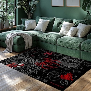 May include: Black rectangular area rug featuring a red spider emblem and web design. The rug has a white mathematical formula pattern and a red spider-man graphic. The rug is placed on a wooden floor in front of a green sofa.