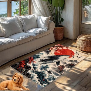 May include: A rectangular area rug featuring a detailed illustration of a whale breaching from dark blue ocean waves, accented by vibrant red maple leaves, a large red sun, and flying cranes against a cream-colored background.