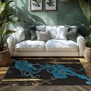May include: A rectangular area rug featuring a teal octopus design on a black background. The octopus has detailed tentacles and is set against a gold-colored circular and floral border. The rug is placed in front of a white sofa.