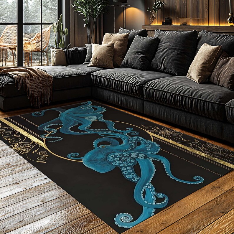 May include: A rectangular black area rug featuring two blue octopuses within a gold circular design. The rug has a gold border with floral accents. The rug is placed on a wooden floor in front of a dark gray sectional sofa.