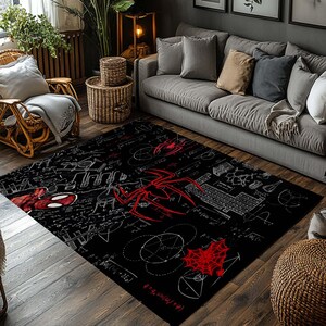 May include: Black rectangular area rug featuring a red spider and spider web design. White mathematical equations and a keyboard graphic are also present. The rug is placed in a living room setting with a gray sofa and wooden furniture.