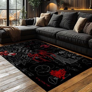 May include: Black rectangular area rug featuring a red spider graphic and white mathematical equations. The rug has a large red spider design in the center, with a web design and other graphics. The rug is placed on a wooden floor.