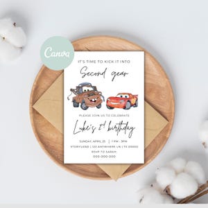 May include: A birthday invitation featuring illustrations of Mater and Lightning McQueen from the movie Cars. The invitation includes the text "It's time to kick it into Second gear" and details for Luke's 2nd birthday.