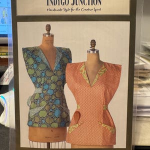 May include: A sewing pattern for a classic overall, featuring two mannequins wearing different fabric designs. The pattern is titled "Classic Coverall 1J793" and is a "Secely Palmer Design".