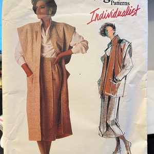May include: Vogue Patterns Individualist sewing pattern for a long brown jacket and skirt, designed by Jenny Sharp, pattern number 1412.