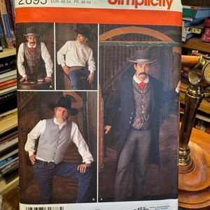 May include: A Simplicity pattern envelope featuring a Western-themed design. The envelope displays images of men in cowboy attire, including vests, hats, and long coats. The text on the envelope includes the pattern number, size, and brand name.