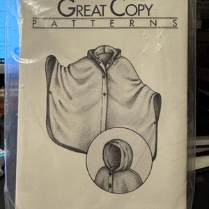 May include: A sewing pattern for a three-season cape, from Great Copy Patterns, pattern number #2000. The pattern includes a drawing of the cape with a hood.