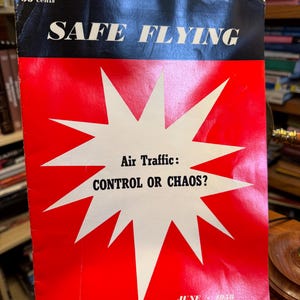 May include: A vintage magazine titled SAFE FLYING from June 1958, priced at 50 cents. The cover features a bold red background with a large white starburst graphic containing the text Air Traffic: CONTROL OR CHAOS? in black lettering.