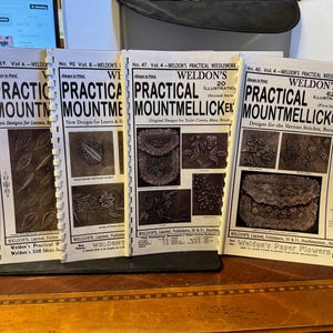 May include: Four vintage books titled "Weldon's Practical Mountmellick Embroidery" with illustrations of embroidery designs. The books are bound with metal rings and have a white background with black text.