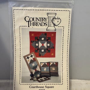 May include: A quilting pattern from Country Threads for a Courthouse Square quilt. The pattern includes instructions for a quilt, a table runner, and two pillows. The pattern is number 169.