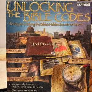 May include: A sealed CD-ROM box titled "UNLOCKING THE BIBLE CODES" with gold lettering. The box features images of historical events, a Bible, and a magnifying glass over text. The software claims to translate English to Hebrew and provide insights.