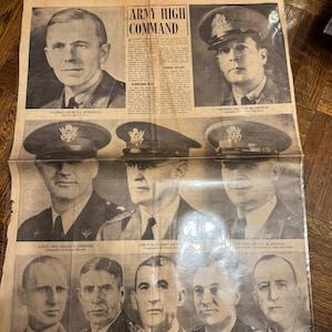 May include: A black and white newspaper clipping featuring a group of men in military uniform. The headline reads "Army High Command". The men are identified as General George C. Marshall, General J.C. MacArthur, Lieutenant General Delos C. Emmons, Lieutenant General John J. De Witt, Lieutenant General Henry H. Arnold, Lieutenant General Jacob L. Devers, Lieutenant General Ben Lear, Lieutenant General Walter Krueger, Lieutenant General Frank Andrews, and Lieutenant General Hugh A. Drum.