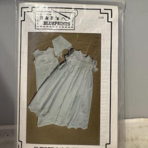 May include: A sewing pattern for a christening ensemble for babies. The pattern includes a dress, bonnet, and instructions for sizes 3 to 24 months. The pattern is from B&B's Blueprints and is numbered 139.
