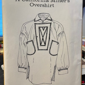 May include: A black and white line drawing of a California Miner's Overshirt. The shirt has a yoke, a pointed collar, and two large pockets. The text "SIZES INCLUDED - M - L - XL" is printed at the bottom of the image.