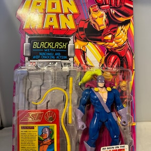May include: Blacklash action figure from the Marvel Comics Iron Man series. The figure is wearing a blue and purple costume with a yellow whip. The packaging features a red and yellow Iron Man illustration and the text "Blacklash with Nunchuku and Whip Cracking Action".