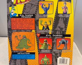 May include: The back of a vintage action figure package for "The Tick" cartoon series. The package features images of various characters, including "Hurling Tick" and "Evil Tongue Thrakkorzog."