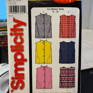 May include: Simplicity sewing pattern number 5376, "It's So Easy", for Misses' sizes 8-18. The pattern includes instructions for making five different sleeveless tops: a gray top, a red and white plaid top, a yellow top, a blue top, and a pink top with a red and white geometric pattern.