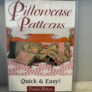 May include: A package of pillowcase patterns from Patches Pallette. The package shows a variety of pillowcases on a bed with a red and white quilt. The text on the package reads "Pillowcase Patterns Quick & Easy!"