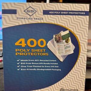 May include: A box of 400 clear poly sheet protectors made from 40% recycled content. The box features a blue and white design with the text "400 Poly Sheet Protectors" and "Supplies Sense". The box also includes the following information: "Made from 40% Recycled Content", "$10 Free Bonus Gift Bundle Included", "One Tree Planted for Every Unit Sold", and "Eco-Friendly Biodegradable Packaging".