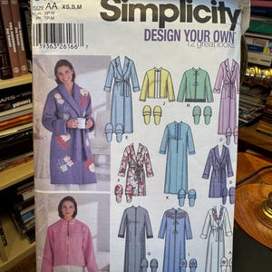 May include: A Simplicity 5778 sewing pattern envelope for loungewear, including robes, jackets, and slippers. The white paper envelope features illustrations of various garment styles in blue, pink, yellow, and floral patterns, with text labels and a barcode.