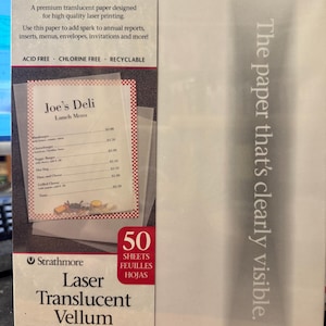 May include: A pack of 50 sheets of Strathmore Laser Translucent Vellum paper. The paper is 8.5 inches by 11 inches and weighs 29 pounds. The pack is white with blue and red text. The paper is translucent and suitable for laser printing.