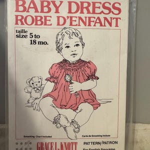 May include: A pattern for a baby dress, size 5 to 18 months, with a smocking chart included. The pattern is from Grace L. Knott Smocking Supplies Ltd. and is for English smocking.