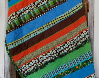 42 x 60 inches -Assorted -Flannel Strip Quilt- -Flannel Fringe, Ric Rac, Ribbon, Accents, Solid Flannel Back