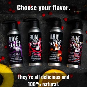 Four bottles of edible massage oil are shown propped with cinnamon candies and tropical fruit. The silver bottles have pump tops and the labels read "Rub Me the Right Way." Made with culinary-grade flavoring oils for a delicious adventure.