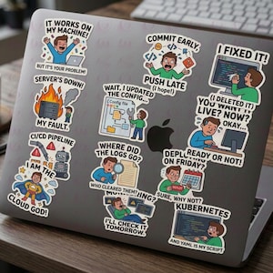 May include: A laptop covered in colorful stickers with humorous phrases related to software development. Stickers include text like "It works on my machine!" and "I fixed it!" A coffee mug and pen are on the wooden surface.