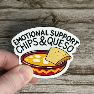 May include: A white sticker with the text "EMOTIONAL SUPPORT CHIPS & QUESO" above a cartoon image of a bowl of queso with a tortilla chip. The bowl is red and yellow with a wavy design.