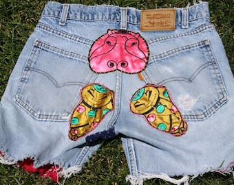 Vintage High Waisted Levi's Upcycled into cutoffs Patches and Embroidery Custom Cutoffs