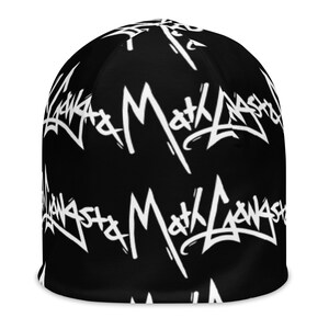 May include: Black beanie with a white repeated pattern of the text "Ganksta Math Lasha" in a graffiti style.