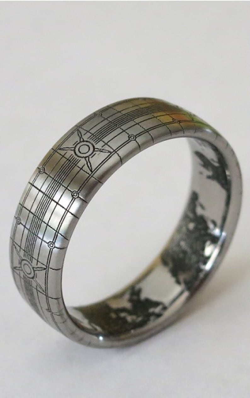 A titanium ring crafted to look like a Halo world, where it looks like a spacecraft from the outside and has detailed engraved continents on the inside. The ring is typically used as a wedding band.