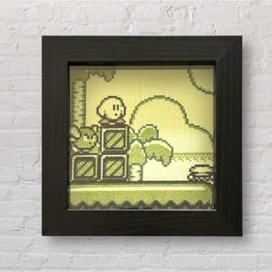 Kirby Dreamland auf dem Gameboy in Kreuzstich Retro Videospiel Illustration