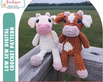 May include: Two crocheted cow plushies, one white and one brown, with pink noses and blue eyes. The plushies are sitting on a wooden railing. The text "LOW SEW DIGITAL CROCHET PATTERN" is on the left side of the image and the text "BETTY THE COW" is at the bottom of the image.