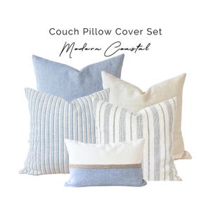 May include: A set of couch pillow covers in a modern coastal style. The pillows are in various shades of blue and white, with striped and solid patterns. The set includes a pillow with a natural rope detail. Text on the image reads "Couch Pillow Cover Set" and "Modern Coastal."