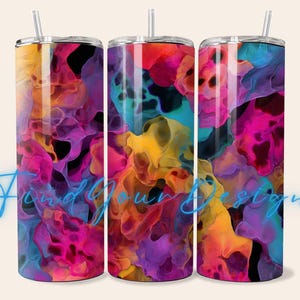 May include: Three stainless steel tumblers with lids and straws. Each tumbler features a vibrant, abstract design in shades of pink, purple, yellow, orange, and blue. The text "Find Your Design" is written in a cursive font across the bottom of the image.