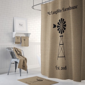 May include: A brown burlap shower curtain with a black windmill graphic and the text "McLaughlin Farmhouse Est. 2018".