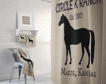 May include: A tan shower curtain with a black silhouette of a horse and the text "CIRCLE K RANCH Est. 2001 MAIZE, KANSAS".