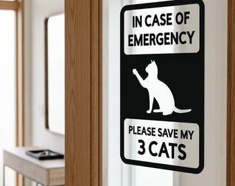 May include: A rectangular black and white decal applied to a glass door panel. The decal features the text IN CASE OF EMERGENCY at the top, a silhouette of a cat in the center, and the text PLEASE SAVE MY 3 CATS at the bottom. The text IMAGE NOT TO SCALE is visible at the bottom.
