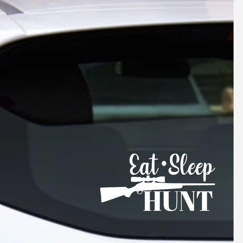May include: White vinyl decal with the words "Eat Sleep HUNT" and a rifle with a scope. The decal is designed to be applied to a car window or other smooth surface.