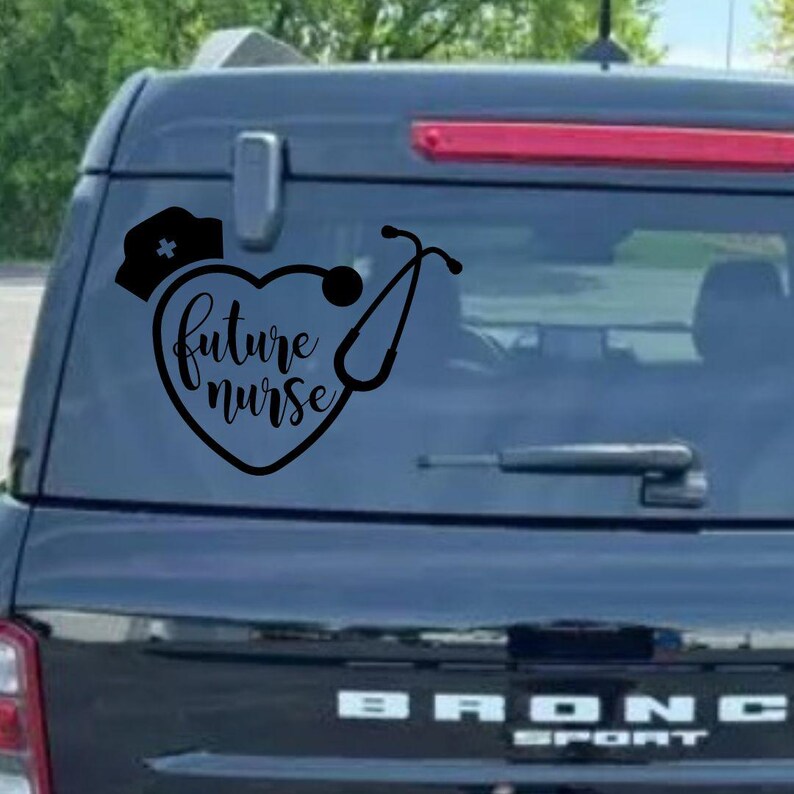 May include: A black and white car decal with a heart shape and the text "future nurse" inside the heart. A stethoscope is wrapped around the heart. A nurse's hat is above the heart.