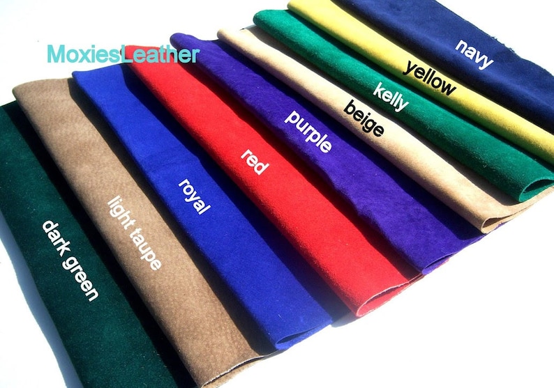 May include: A variety of leather swatches in different colors, including dark green, light taupe, royal blue, red, purple, beige, kelly green, yellow, and navy. The swatches are arranged in a fan shape, with the darkest color at the bottom and the lightest color at the top. The text "MoxiesLeather" is visible in the top left corner of the image.