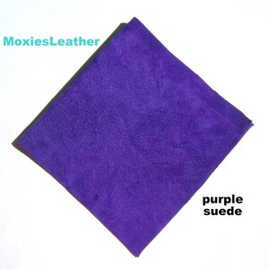May include: A square piece of purple suede fabric.