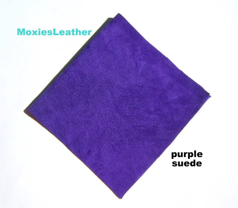 May include: A square piece of purple suede fabric.