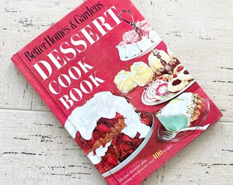 May include: A vintage cookbook titled "Better Homes & Gardens Dessert Cook Book" with a red cover. The cover features images of various desserts. The book's title is in large white letters. The book promises "All-time favorites plus exciting new desserts - over 400 recipes."