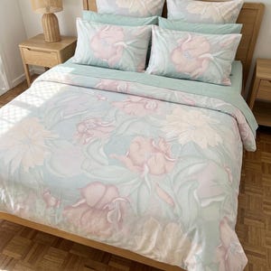 May include: A set of three ceramic mugs with a speckled, matte finish. The mugs are in shades of cream, light gray, and dark gray. Each mug has a simple, modern design and a rounded handle. Perfect for coffee or tea.