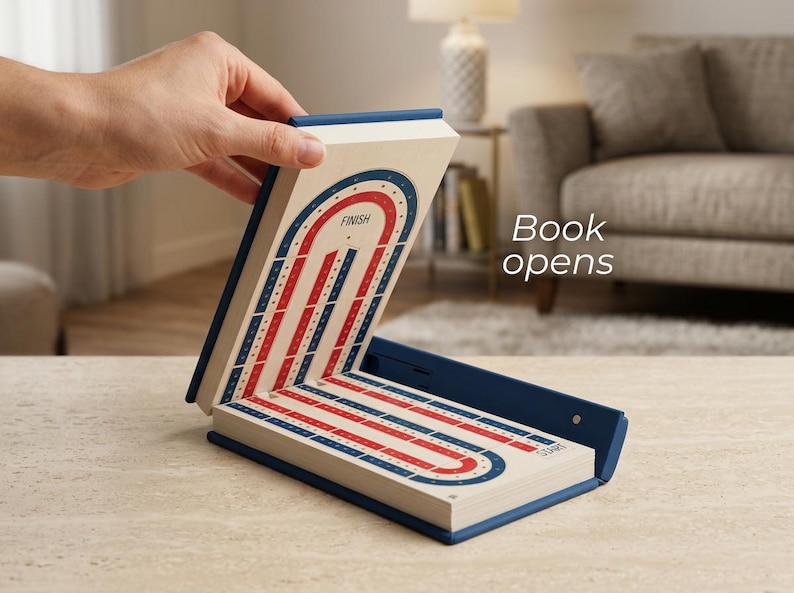 May include: An open, book-shaped game board in blue and white, displaying a red and blue track design. The word "FINISH" is visible. The text "Book opens" is also present.