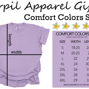 May include: A lilac unisex t-shirt with size chart showing width and length measurements in inches. The chart is labelled "Comfort Colors 1717 Unisex Heavyweight Tee".