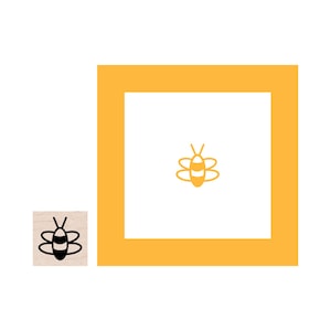 May include: A yellow square frame with a black and white bee illustration inside. The bee has a striped body and wings.
